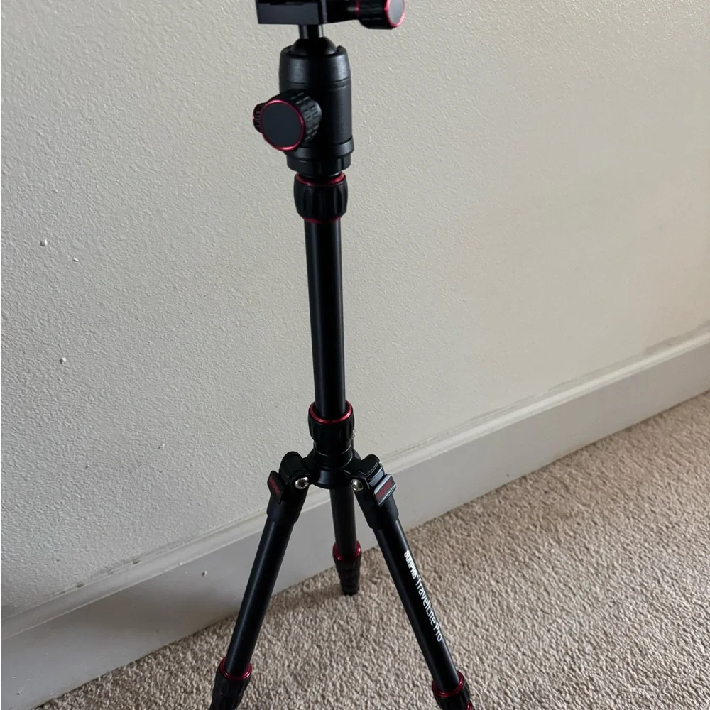 Compact Black Tripod with Red Accents